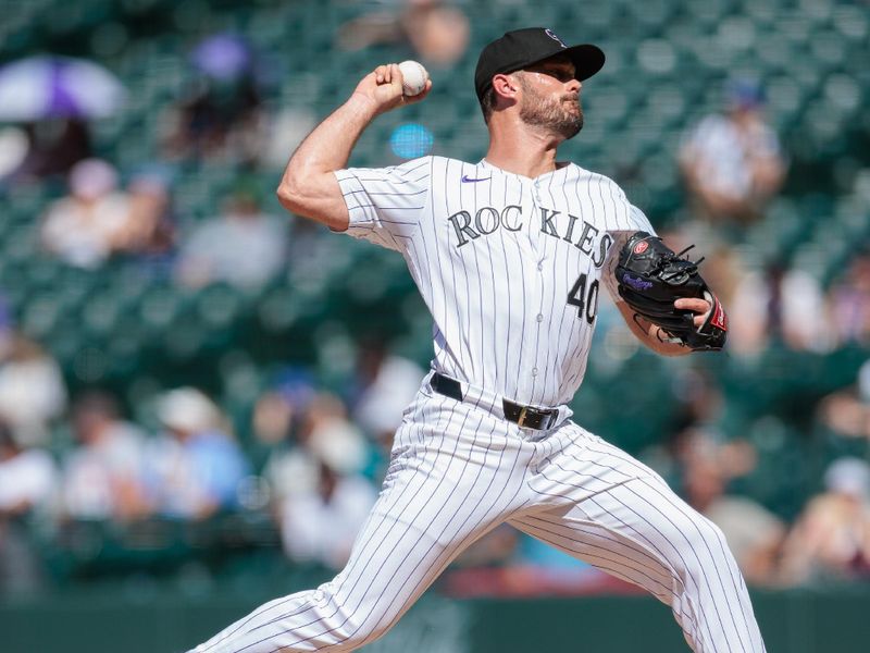 Jun 5, 2024; Denver, Colorado, USA; Colorado Rockies relief pitcher Tyler Kinley (40) delivers a pitch during the eighth inning against the Cincinnati Reds at Coors Field. Mandatory Credit: Andrew Wevers-USA TODAY Sports