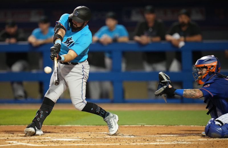 Feb 25, 2023; Port St. Lucie, Florida, USA;  Miami Marlins first baseman Joe Rizzo hits a double in the second inning against New York Mets at Clover Park. Mandatory Credit: Jim Rassol-USA TODAY Sports