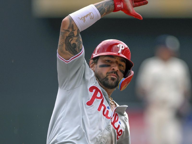 Jul 24, 2024; Minneapolis, Minnesota, USA;  Philadelphia Phillies outfielder Nick Castellanos (8) slides safely into third base against the Minnesota Twins during the second inning at Target Field. Mandatory Credit: Nick Wosika-USA TODAY Sports