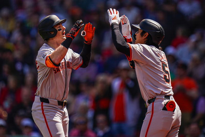 May 2, 2024; Boston, Massachusetts, USA; San Francisco Giants right fielder Mike Yastrzemski (5) is congratulated by center fielder Jung Hoo Lee (51) after hitting a home run against the Boston Red Sox in the third inning at Fenway Park. Mandatory Credit: David Butler II-USA TODAY Sports