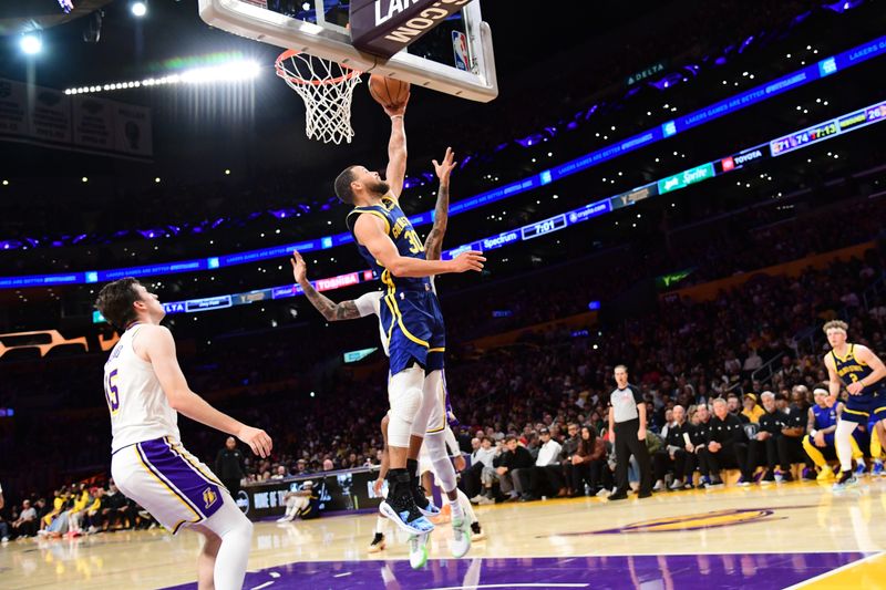 LOS ANGELES, CA - MACH 16: Stephen Curry #30 of the Golden State Warriors drives to the basket during the game against the Los Angeles Lakers on March 16, 2024 at Crypto.Com Arena in Los Angeles, California. NOTE TO USER: User expressly acknowledges and agrees that, by downloading and/or using this Photograph, user is consenting to the terms and conditions of the Getty Images License Agreement. Mandatory Copyright Notice: Copyright 2024 NBAE (Photo by Adam Pantozzi/NBAE via Getty Images)