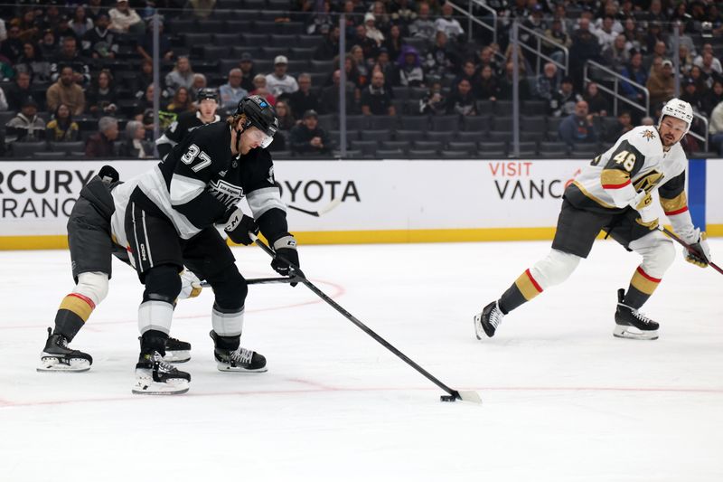 Oct 30, 2024; Los Angeles, California, USA;  Los Angeles Kings left wing Warren Foegele (37) controls the puck during the first period at Crypto.com Arena. Mandatory Credit: Kiyoshi Mio-Imagn Images