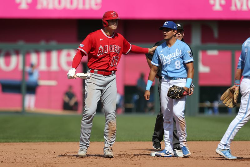 Jun 17, 2023; Kansas City, Missouri, USA; Los Angeles Angels designated hitter Shohei Ohtani (17) congratulates Kansas City Royals second baseman Nicky Lopez (8) on a play at second base during the fourth inning at Kauffman Stadium. Mandatory Credit: Scott Sewell-USA TODAY Sports