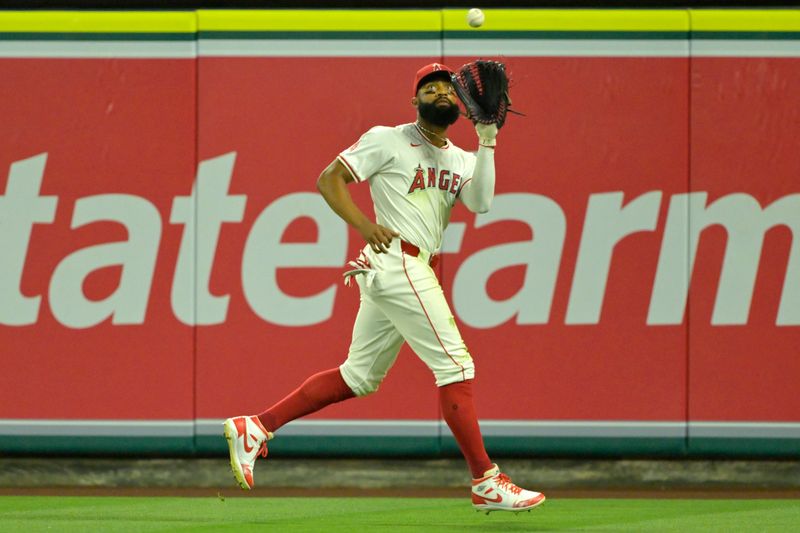 Jun 4, 2024; Anaheim, California, USA;  Los Angeles Angels right fielder Jo Adell (7) makes an out in the ninth inning against the San Diego Padres at Angel Stadium. Mandatory Credit: Jayne Kamin-Oncea-USA TODAY Sports