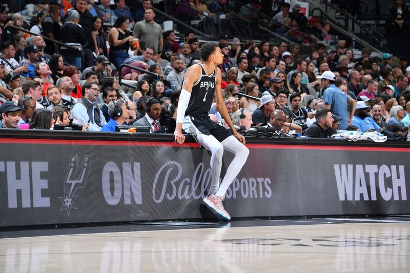 SAN ANTONIO, TX - MARCH 12: Victor Wembanyama #1 of the San Antonio Spurs sits on the scorers table during the game against the Houston Rockets on March 12, 2024 at the Frost Bank Center in San Antonio, Texas. NOTE TO USER: User expressly acknowledges and agrees that, by downloading and or using this photograph, user is consenting to the terms and conditions of the Getty Images License Agreement. Mandatory Copyright Notice: Copyright 2024 NBAE (Photos by Michael Gonzales/NBAE via Getty Images)