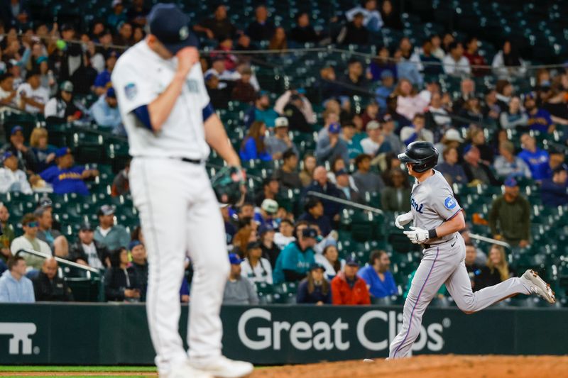 Jun 13, 2023; Seattle, Washington, USA; Miami Marlins designated hitter Garrett Cooper (26) runs the bases after hitting a two-run home run against the Seattle Mariners during the eighth inning at T-Mobile Park. Mandatory Credit: Joe Nicholson-USA TODAY Sports