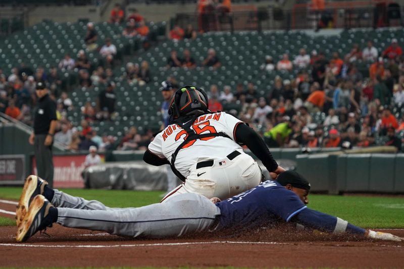 Sep 24, 2025; Baltimore, Maryland, USA; Tampa Bay Rays outfielder Chandler Simpson (14) scores during the first inning against the Baltimore Orioles at Oriole Park at Camden Yards. Mandatory Credit: Mitch Stringer-Imagn Images