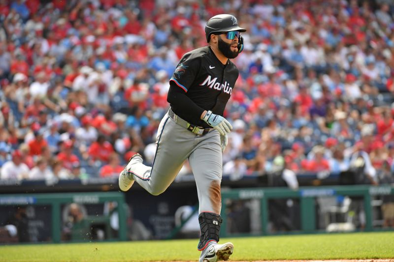 Jun 30, 2024; Philadelphia, Pennsylvania, USA; Miami Marlins third base Emmanuel Rivera (15) hits an RBI single against the Philadelphia Phillies during the fifth inning at Citizens Bank Park. Mandatory Credit: Eric Hartline-USA TODAY Sports