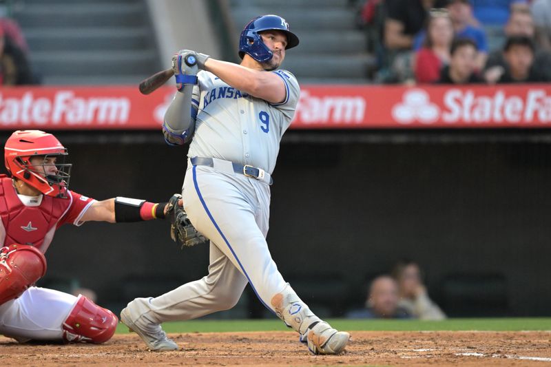 May 9, 2024; Anaheim, California, USA;  Kansas City Royals first baseman Vinnie Pasquantino (9) follows through on a two-run home run against the Los Angeles Angels in the third inning at Angel Stadium. Mandatory Credit: Jayne Kamin-Oncea-USA TODAY Sports