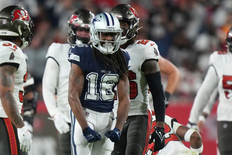 Dallas Cowboys wide receiver T.Y. Hilton (16) flex after his first down catch and run during an NFL wild-card football game against the Tampa Bay Buccaneers, Monday, Jan. 16, 2023, in Tampa, Fla. (AP Photo/Peter Joneleit)