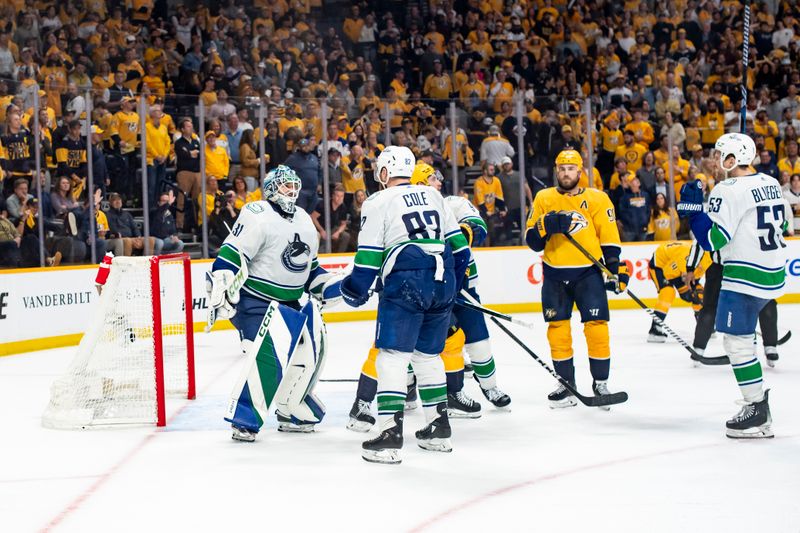 May 3, 2024; Nashville, Tennessee, USA; Vancouver Canucks celebrate the win against the Nashville Predators following game six of the first round of the 2024 Stanley Cup Playoffs at Bridgestone Arena. Mandatory Credit: Steve Roberts-USA TODAY Sports