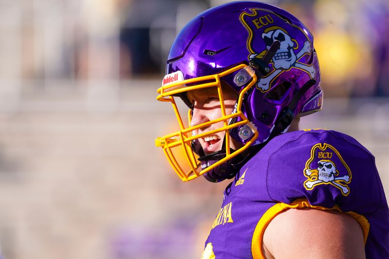 Sep 25, 2021; Greenville, North Carolina, USA;  East Carolina Pirates quarterback Holton Ahlers (12) looks on before the game against the Charleston Southern Buccaneers at Dowdy-Ficklen Stadium. Mandatory Credit: James Guillory-USA TODAY Sports