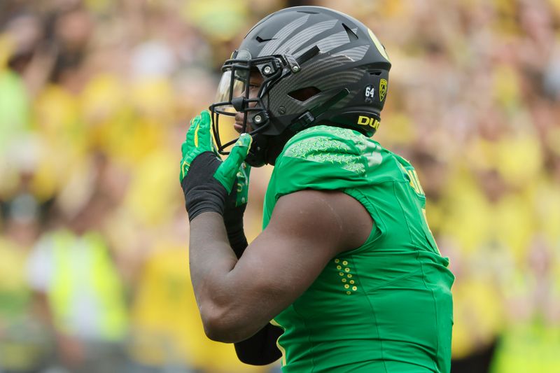 Sep 23, 2023; Eugene, Oregon, USA; Oregon Ducks defensive end Jordan Burch (1) celebrates after a sack during the first half against the Colorado Buffaloes at Autzen Stadium. Mandatory Credit: Soobum Im-USA TODAY Sports