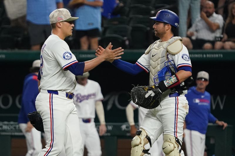 May 17, 2025; Arlington, Texas, USA; Texas Rangers outfielder Adolis García (53) and catcher Kyle Higashioka (11) shake hands following the game against the Houston Astros at Globe Life Field. Mandatory Credit: Raymond Carlin III-Imagn Images