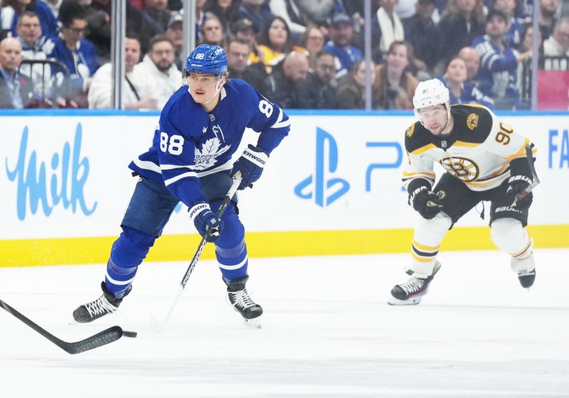 Nov 5, 2024; Toronto, Ontario, CAN; Toronto Maple Leafs right wing William Nylander (88) skates with the puck Boston Bruins centre Tyler Johnson (90) gives chase during the first period at Scotiabank Arena. Mandatory Credit: Nick Turchiaro-Imagn Imagess