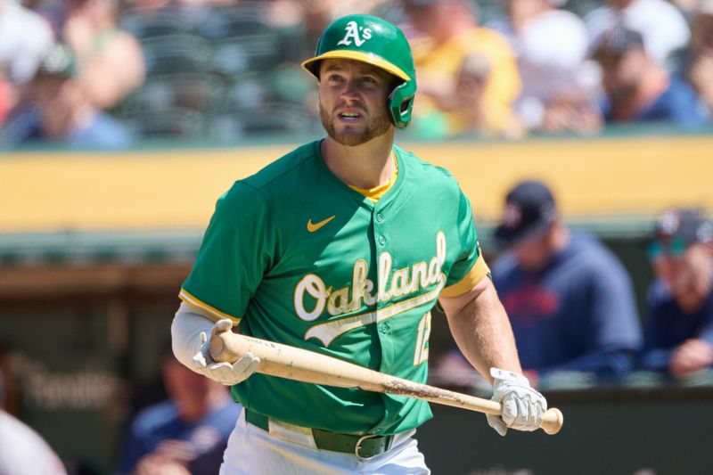 May 26, 2024; Oakland, California, USA; Oakland Athletics infielder Max Schuemann (12) bats against the Houston Astros during the eighth inning at Oakland-Alameda County Coliseum. Mandatory Credit: Robert Edwards-USA TODAY Sports