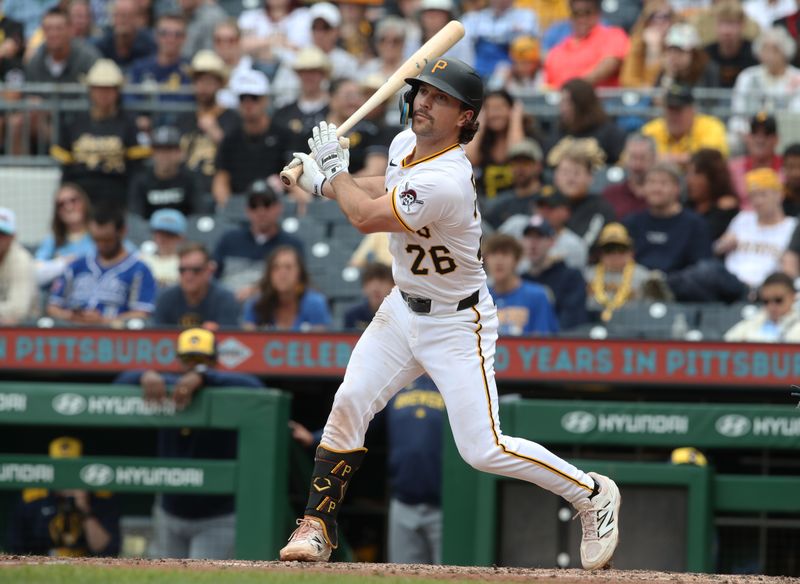 May 25, 2025; Pittsburgh, Pennsylvania, USA;  Pittsburgh Pirates second baseman Adam Frazier (26) hits a two run double against the Milwaukee Brewers during the seventh inning at PNC Park. Mandatory Credit: Charles LeClaire-Imagn Images