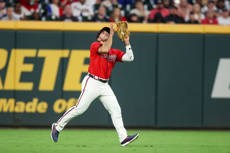 Sep 13, 2024; Atlanta, Georgia, USA; Atlanta Braves left fielder Ramon Laureano (18) catches a fly ball against the Los Angeles Dodgers in the third inning at Truist Park. Mandatory Credit: Brett Davis-Imagn Images