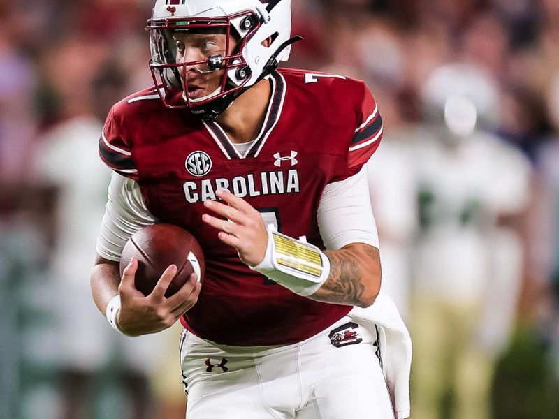 Sep 24, 2022; Columbia, South Carolina, USA; South Carolina Gamecocks quarterback Spencer Rattler (7) scrambles against the Charlotte 49ers in the second quarter at Williams-Brice Stadium. Mandatory Credit: Jeff Blake-USA TODAY Sports