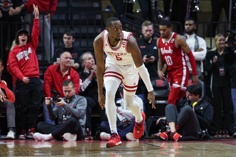 Jan 17, 2024; Piscataway, New Jersey, USA; Rutgers Scarlet Knights forward Aundre Hyatt (5) reacts after making a three point basket during the first half against the Nebraska Cornhuskers  at Jersey Mike's Arena. Mandatory Credit: Vincent Carchietta-USA TODAY Sports