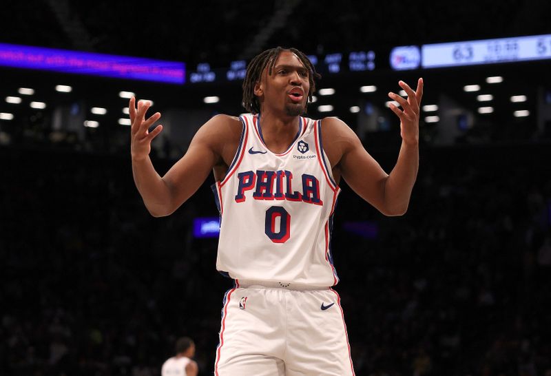 NEW YORK, NEW YORK - NOVEMBER 19:  Tyrese Maxey #0 of the Philadelphia 76ers reacts to a call against the Philadelphia 76ers in the second half against the Brooklyn Nets at Barclays Center on November 19, 2023 in the Brooklyn borough of New York City. The Philadelphia 76ers defeated the Brooklyn Nets 121-99. NOTE TO USER: User expressly acknowledges and agrees that, by downloading and or using this photograph, User is consenting to the terms and conditions of the Getty Images License Agreement. (Photo by Elsa/Getty Images)