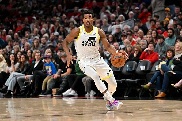 PORTLAND, OREGON - DECEMBER 14: Ochai Agbaji #30 of the Utah Jazz dribbles during the second quarter of the game \H at Moda Center on December 14, 2023 in Portland, Oregon. NOTE TO USER: User expressly acknowledges and agrees that, by downloading and or using this Photograph, user is consenting to the terms and conditions of the Getty Images License Agreement. (Photo by Alika Jenner/Getty Images)