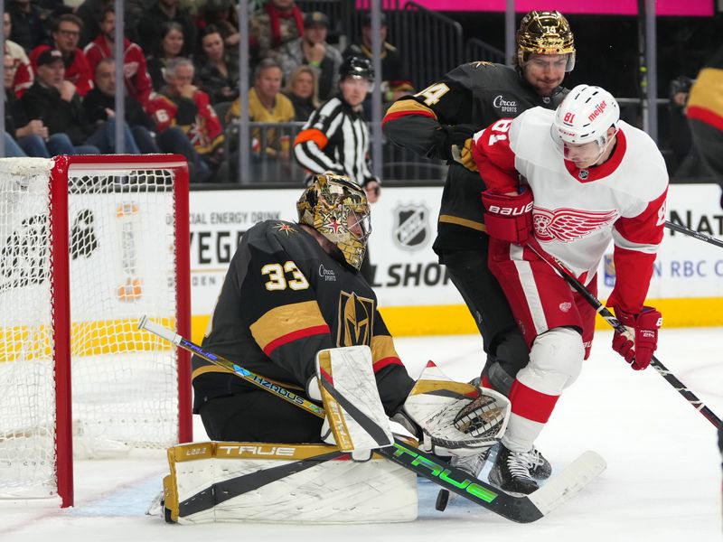 Jan 19, 2023; Las Vegas, Nevada, USA; Vegas Golden Knights goaltender Adin Hill (33) makes a save as Vegas Golden Knights defenseman Nicolas Hague (14) checks Detroit Red Wings left wing Dominik Kubalik (81) during the first period at T-Mobile Arena. Mandatory Credit: Stephen R. Sylvanie-USA TODAY Sports