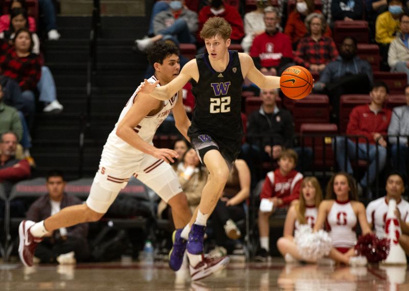 Feb 26, 2023; Stanford, California, USA; Washington Huskies guard Cole Bajema (22) grabs a loose ball in front of Stanford Cardinal forward Brandon Angel (23) during the second half at Maples Pavilion. Mandatory Credit: D. Ross Cameron-USA TODAY Sports