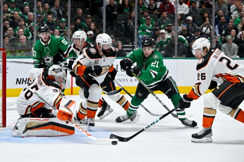 Jan 25, 2024; Dallas, Texas, USA; Dallas Stars center Wyatt Johnston (53) and left wing Jason Robertson (21) and Anaheim Ducks goaltender John Gibson (36) and defenseman Radko Gudas (7) and left wing Brock McGinn (26) battle for control of the puck in the Ducks zone during the second period at the American Airlines Center. Mandatory Credit: Jerome Miron-USA TODAY Sports