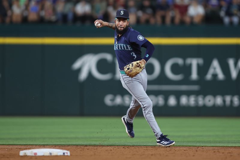 Sep 20, 2024; Arlington, Texas, USA; Seattle Mariners shortstop J.P. Crawford (3) throws to first against the Texas Rangers in the third inning at Globe Life Field. Mandatory Credit: Tim Heitman-Imagn Images