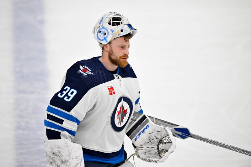 Apr 11, 2024; Dallas, Texas, USA; Winnipeg Jets goaltender Laurent Brossoit (39) skates back up the ice during the second period against the Dallas Stars at the American Airlines Center. Mandatory Credit: Jerome Miron-USA TODAY Sports