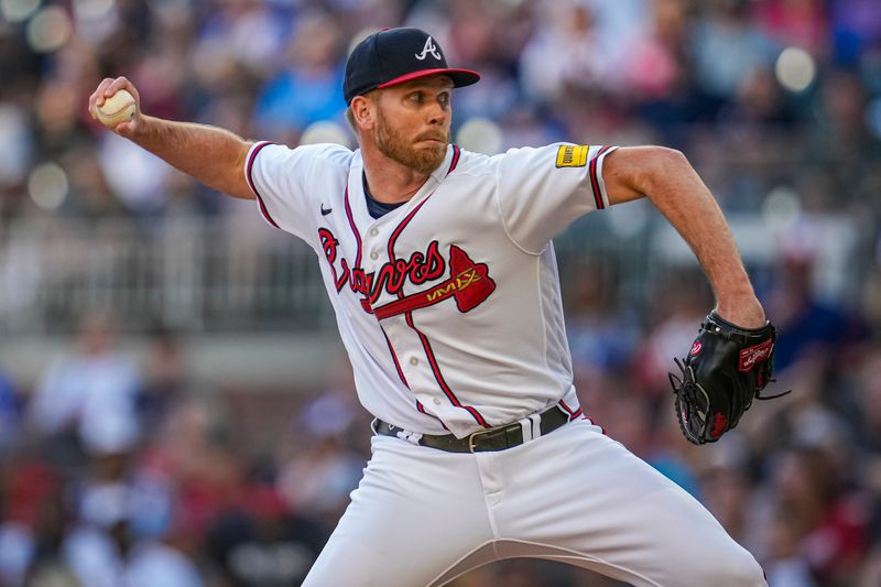 Oct 1, 2023; Cumberland, Georgia, USA; Atlanta Braves relief pitcher Michael Tonkin (51) pitches against the Washington Nationals during the ninth inning at Truist Park. Mandatory Credit: Dale Zanine-USA TODAY Sports