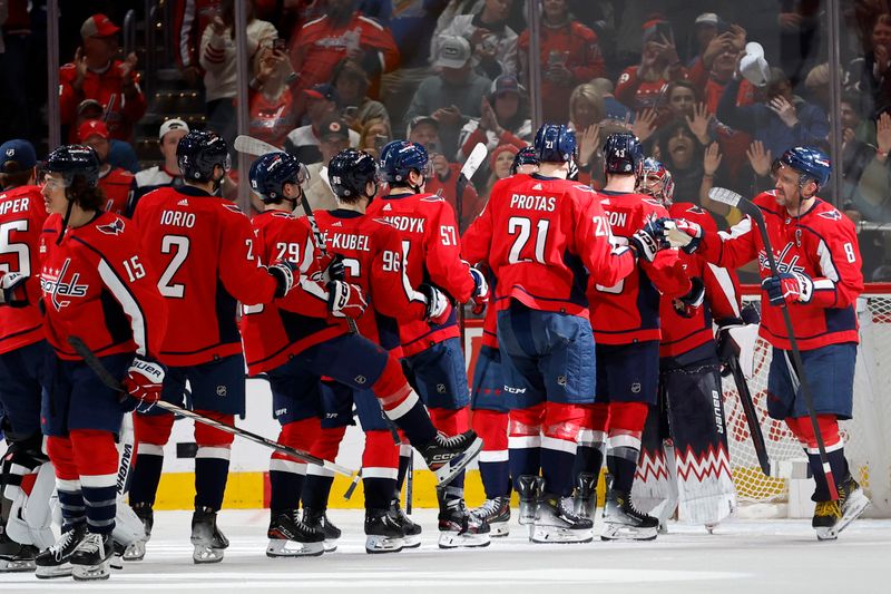 Apr 13, 2024; Washington, District of Columbia, USA; Washington Capitals celebrate after their game against the Tampa Bay Lightning at Capital One Arena. Mandatory Credit: Geoff Burke-USA TODAY Sports