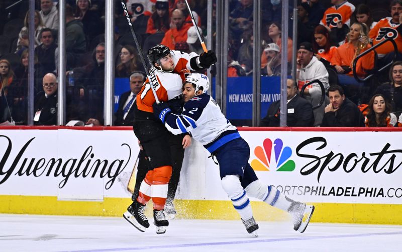 Feb 8, 2024; Philadelphia, Pennsylvania, USA; Winnipeg Jets defenseman Dylan DeMelo (2) hits Philadelphia Flyers right wing Tyson Foerster (71) in the third period at Wells Fargo Center. Mandatory Credit: Kyle Ross-USA TODAY Sports