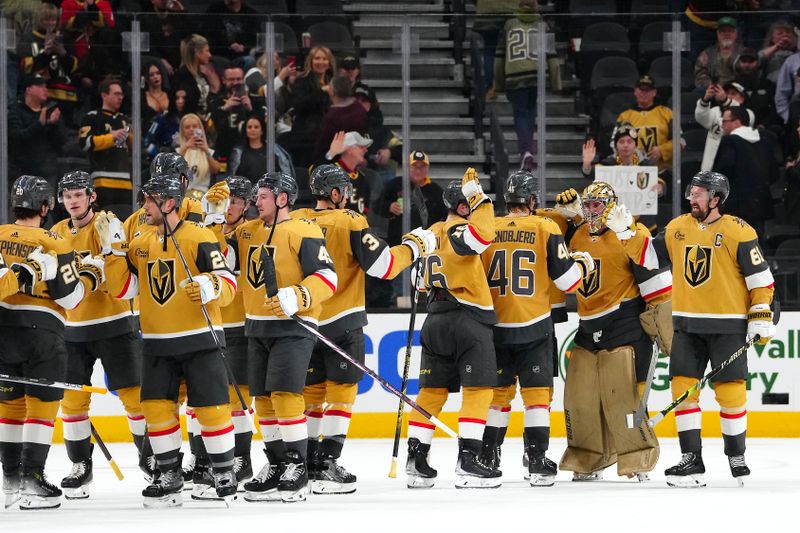 Jan 20, 2024; Las Vegas, Nevada, USA; Vegas Golden Knights players celebrate after defeating the Pittsburgh Penguins 3-2 at T-Mobile Arena. Mandatory Credit: Stephen R. Sylvanie-USA TODAY Sports