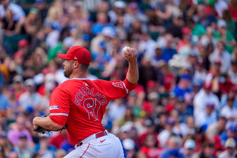 Mar 16, 2024; Tempe, Arizona, USA; Los Angeles Angels pitcher Hunter Strickland (61) pitches in the eighth during a spring training game against the Chicago Cubs at Tempe Diablo Stadium. Mandatory Credit: Allan Henry-USA TODAY Sports