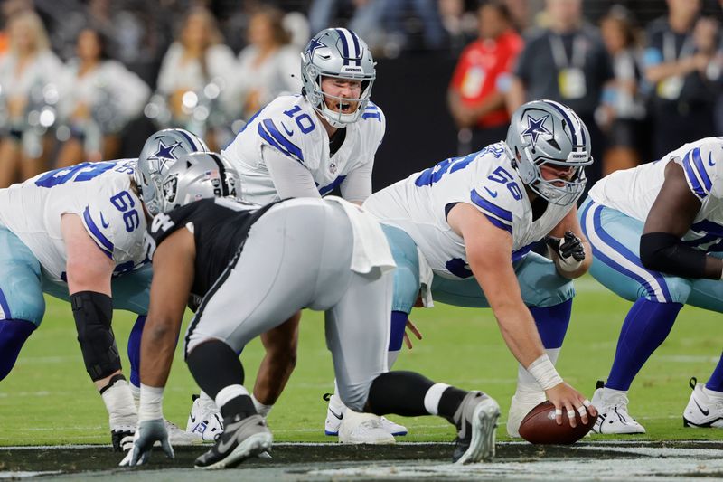 Dallas Cowboys quarterback Cooper Rush (10) plays against the Las Vegas Raiders during the first half of an NFL preseason football game, Saturday, Aug. 17, 2024, in Las Vegas. (AP Photo/Steve Marcus)