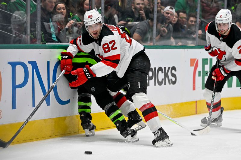 Mar 14, 2024; Dallas, Texas, USA; New Jersey Devils defenseman Santeri Hatakka (82) checks Dallas Stars center Joe Pavelski (16) during the second period at the American Airlines Center. Mandatory Credit: Jerome Miron-USA TODAY Sports