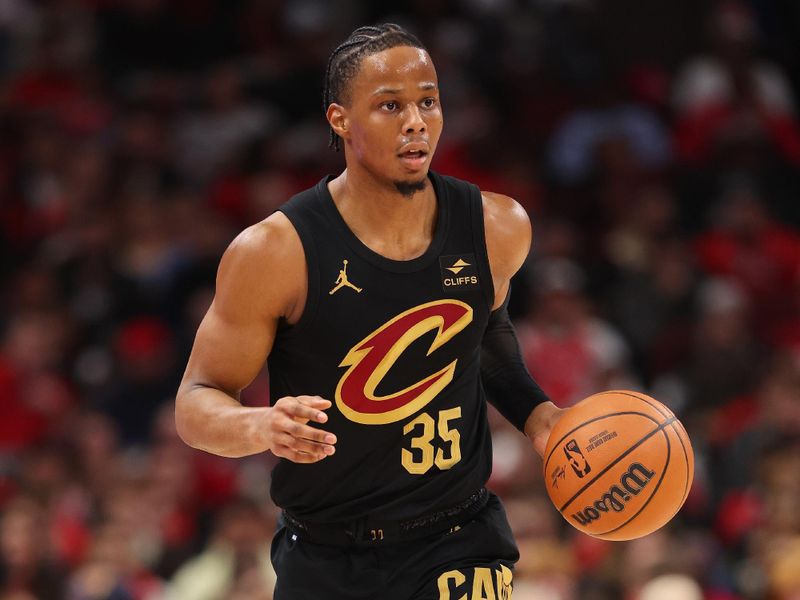 CHICAGO, ILLINOIS - DECEMBER 23: Isaac Okoro #35 of the Cleveland Cavaliers dribbles up the court against the Chicago Bulls during the first half at the United Center on December 23, 2023 in Chicago, Illinois. NOTE TO USER: User expressly acknowledges and agrees that, by downloading and or using this photograph, User is consenting to the terms and conditions of the Getty Images License Agreement.  (Photo by Michael Reaves/Getty Images)