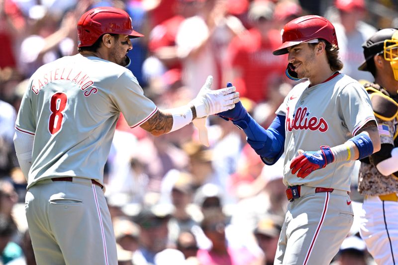 Apr 28, 2024; San Diego, California, USA; Philadelphia Phillies second baseman Bryson Stott (right) celebrates with right fielder Nick Castellanos (8) after hitting a home run against the San Diego Padres during the second inning at Petco Park. Mandatory Credit: Orlando Ramirez-USA TODAY Sports