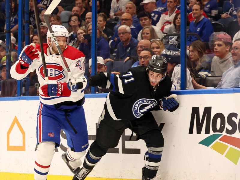 Mar 2, 2024; Tampa, Florida, USA;  Montreal Canadiens right wing Joel Armia (40) and Tampa Bay Lightning center Anthony Cirelli (71) skate after the puck during the third period at Amalie Arena. Mandatory Credit: Kim Klement Neitzel-USA TODAY Sports