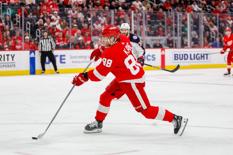 Mar 19, 2024; Detroit, Michigan, USA; Detroit Red Wings right wing Patrick Kane (88) shoots the puck during the third period of the game against the Columbus Blue Jackets at Little Caesars Arena. Mandatory Credit: Brian Bradshaw Sevald-USA TODAY Sports