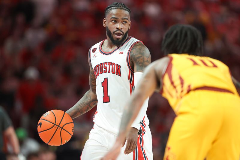 Feb 19, 2024; Houston, Texas, USA; Houston Cougars guard Jamal Shead (1) controls the ball as Iowa State Cyclones guard Keshon Gilbert (10) defends during the game at Fertitta Center. Mandatory Credit: Troy Taormina-USA TODAY Sports