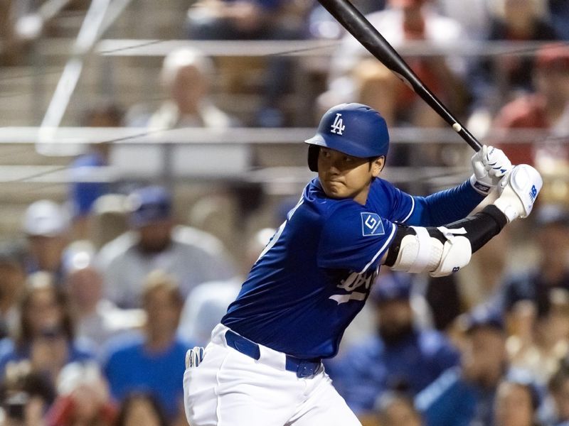 Feb 28, 2025; Phoenix, Arizona, USA; Los Angeles Dodgers designated hitter Shohei Ohtani (17) against the Los Angeles Angels during a spring training game at Camelback Ranch-Glendale. Mandatory Credit: Mark J. Rebilas-Imagn Images