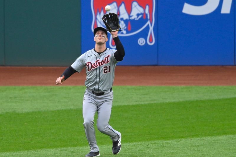 May 6, 2024; Cleveland, Ohio, USA; Detroit Tigers left fielder Mark Canha (21) makes a catch in the first inning against the Cleveland Guardians at Progressive Field. Mandatory Credit: David Richard-USA TODAY Sports