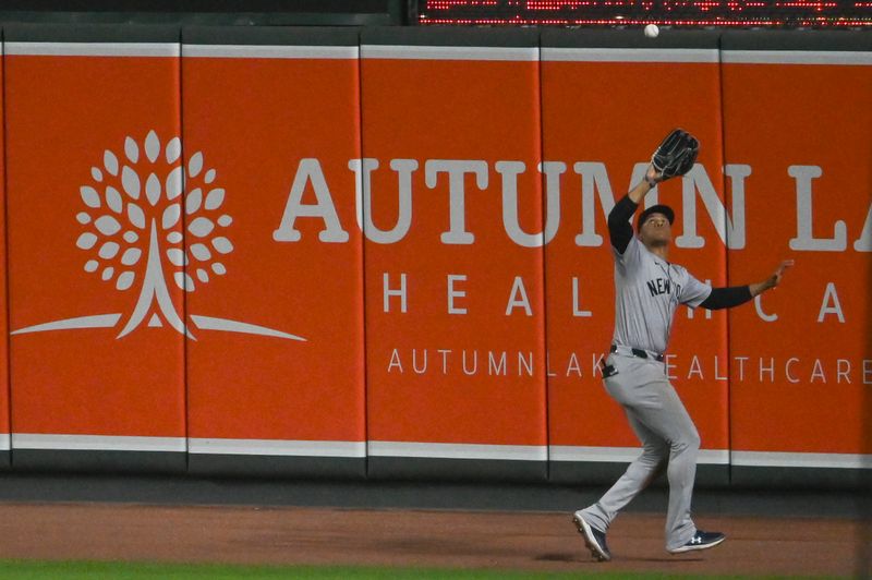 May 1, 2024; Baltimore, Maryland, USA;  New York Yankees outfielder Juan Soto (22) runs down  a seventh inning fly ball against the Baltimore Orioles at Oriole Park at Camden Yards. Mandatory Credit: Tommy Gilligan-USA TODAY Sports