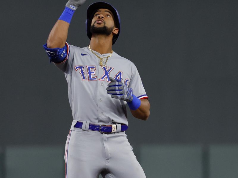 Aug 25, 2023; Minneapolis, Minnesota, USA; Texas Rangers center fielder Leody Taveras (3) celebrates his double against the Minnesota Twins in the fifth inning at Target Field. Mandatory Credit: Bruce Kluckhohn-USA TODAY Sports