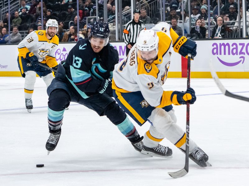 Nov 20, 2024; Seattle, Washington, USA;  Nashville Predators forward Filip Forsberg (9) skates against Seattle Kraken forward Brandon Tanev (13) during the third period at Climate Pledge Arena. Mandatory Credit: Stephen Brashear-Imagn Images