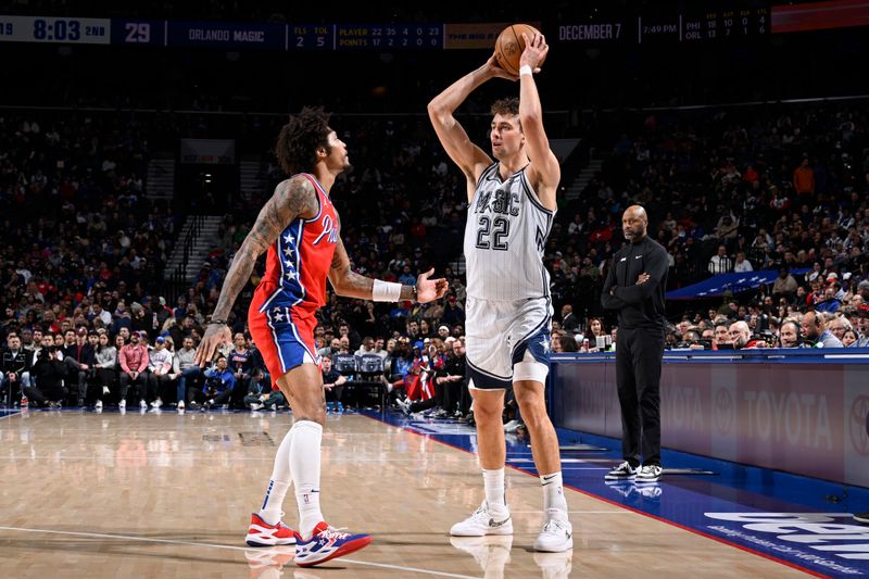 PHILADELPHIA, PA - DECEMBER 6: Franz Wagner #22 of the Orlando Magic looks to pass the ball during the game against the Philadelphia 76ers on December 6, 2024 at the Wells Fargo Center in Philadelphia, Pennsylvania NOTE TO USER: User expressly acknowledges and agrees that, by downloading and/or using this Photograph, user is consenting to the terms and conditions of the Getty Images License Agreement. Mandatory Copyright Notice: Copyright 2024 NBAE (Photo by David Dow/NBAE via Getty Images)