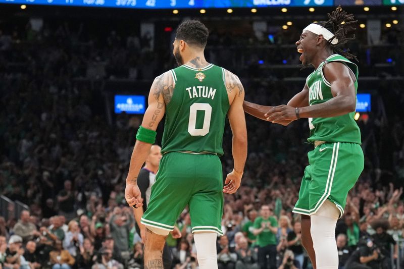 BOSTON, MA - JUNE 17: Jayson Tatum #0 and Jrue Holiday #4 of the Boston Celtics celebrates during the game against the Dallas Mavericks during Game 5 of the 2024 NBA Finals on June 17, 2024 at the TD Garden in Boston, Massachusetts. NOTE TO USER: User expressly acknowledges and agrees that, by downloading and or using this photograph, User is consenting to the terms and conditions of the Getty Images License Agreement. Mandatory Copyright Notice: Copyright 2024 NBAE  (Photo by Jesse D. Garrabrant/NBAE via Getty Images)